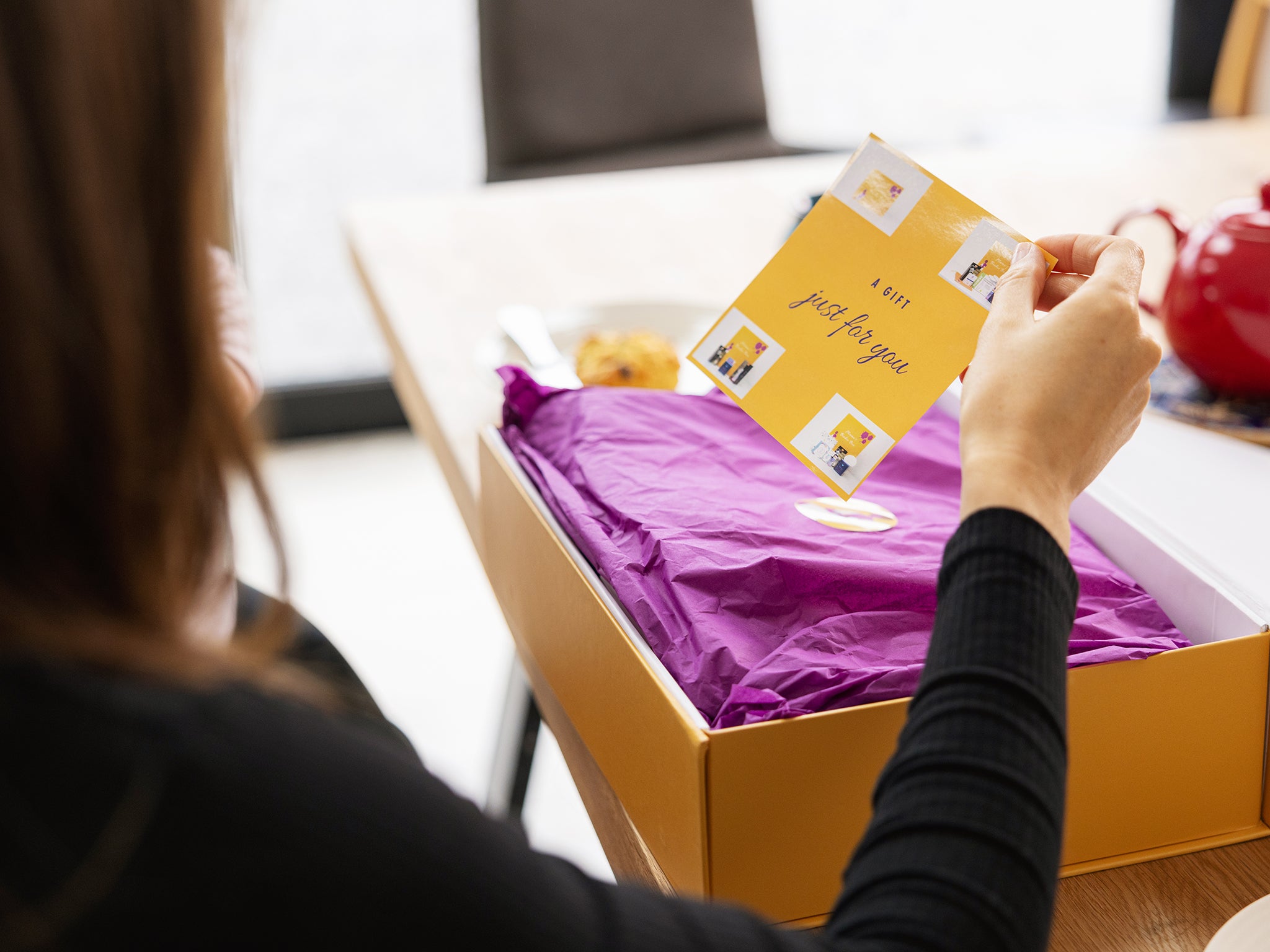 Mum opening the breastfeeding gift box