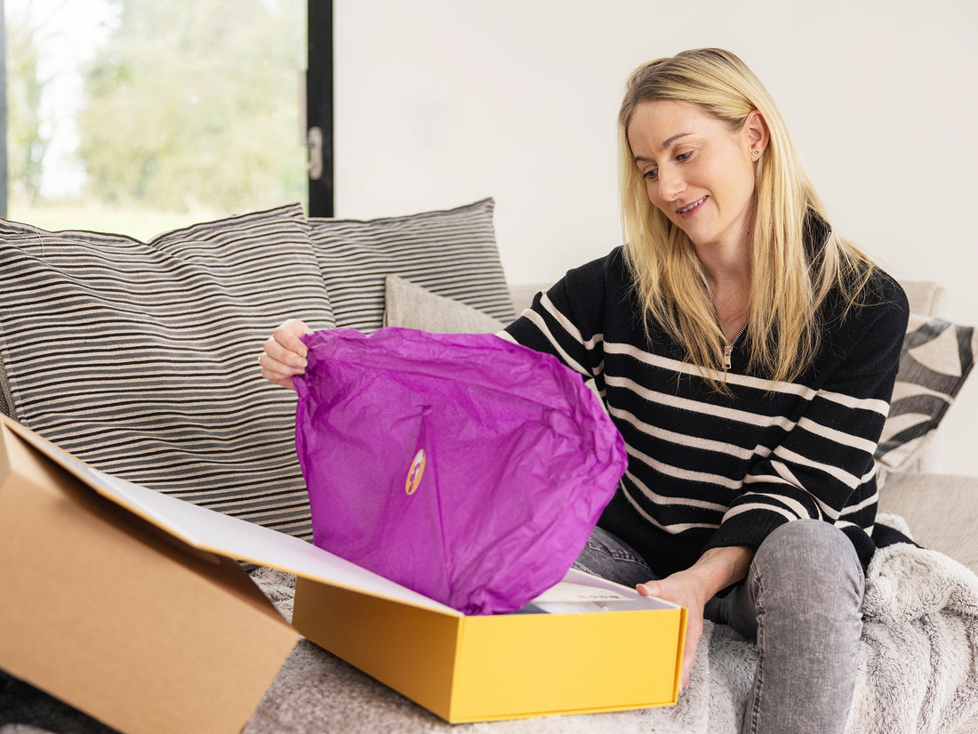 Mum opening nursing Nest Gift Box by Mama&