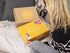 Nursing Nest Gift Box by Mama's Boobie Box- front of box and packaging with mum opening it