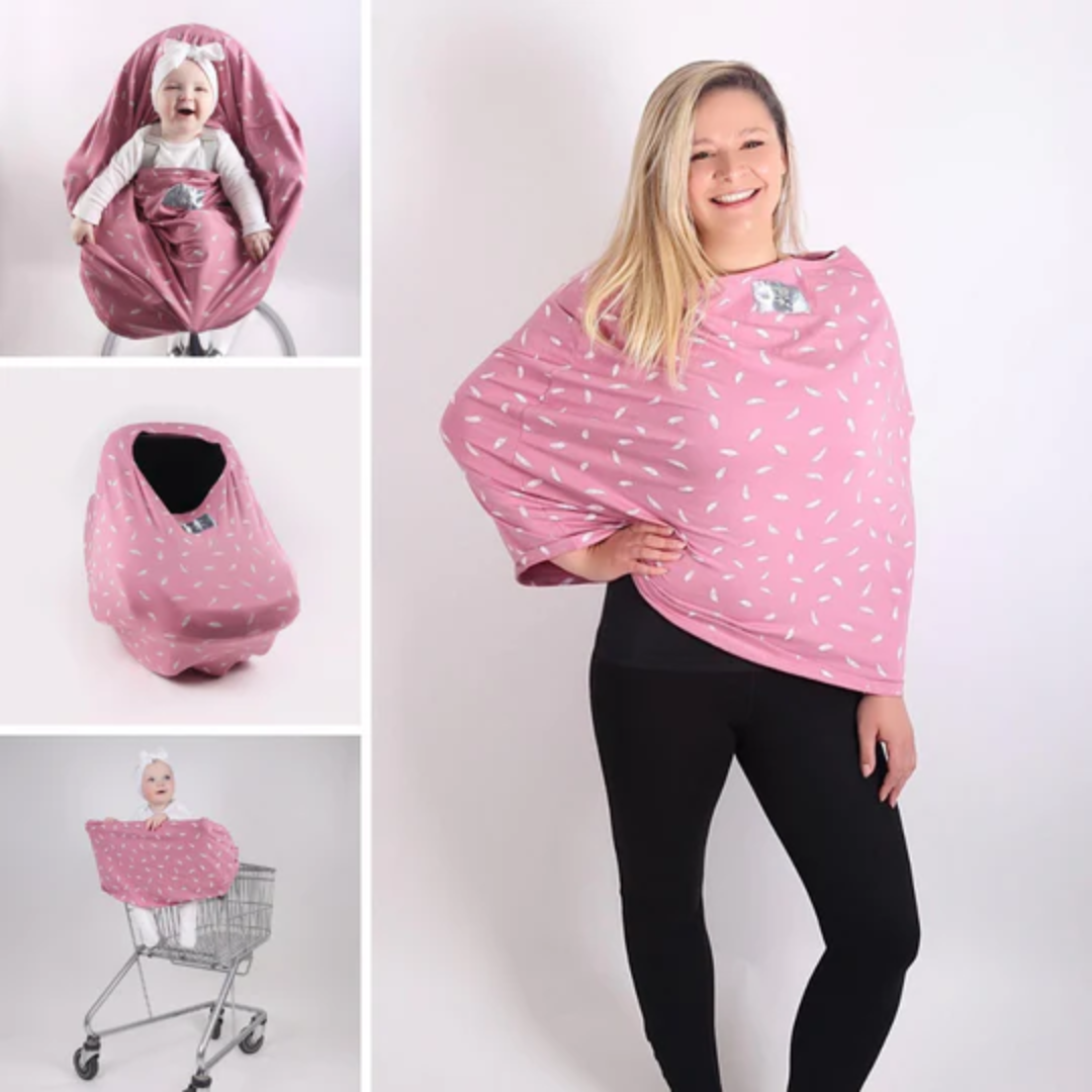 A breastfeeding cover in pink feathers pattern used by nursing mothers to discreetly breastfeed.