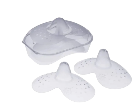 Mam Nipple shields can assist with latching a baby to the breast, shown with steriliser box.